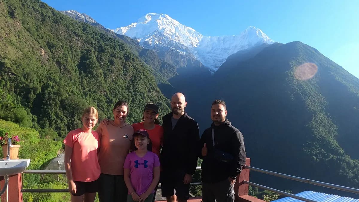 trekkers at chhomrong village with the mountain view