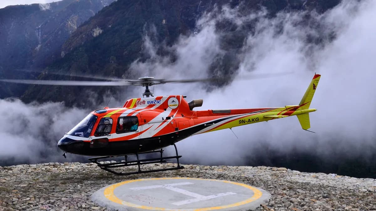 heli everest taking of in everest region above the clouds