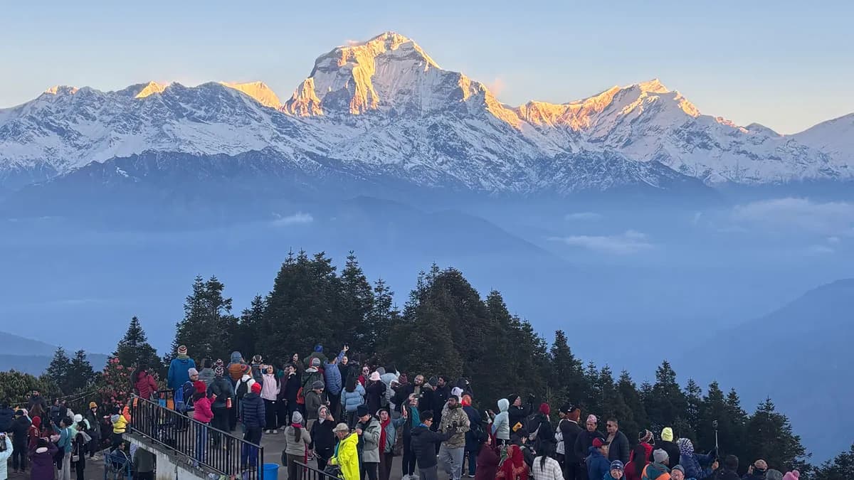 morning view from poon hill ghorepani of mt dhaulagiri and trekkers