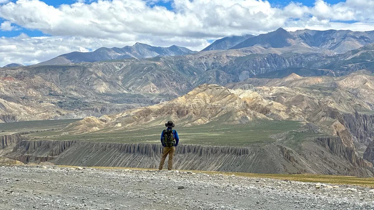 trekker watching upper mustang landscapes