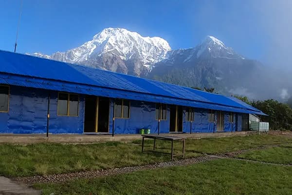 A traditional tea house in Nepal provides simple, cozy mountain accommodation and hot meals for trekkers along popular Himalayan trails