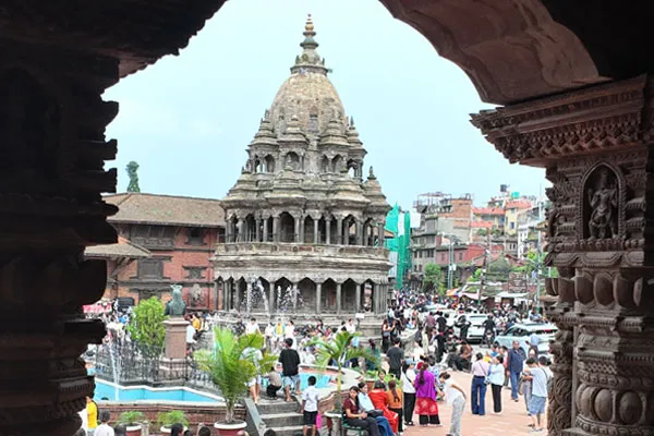 people safely traveling around patan durbar square in nepal
