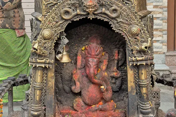 Exploring Kathmandu reveals centuries-old street shrines and intricate religious statues nestled in local courtyards and alleyways.