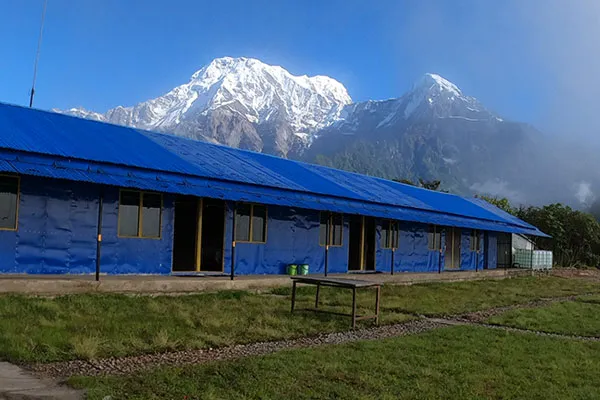 A traditional tea house in Nepal provides simple, cozy mountain accommodation and hot meals for trekkers along popular Himalayan trails