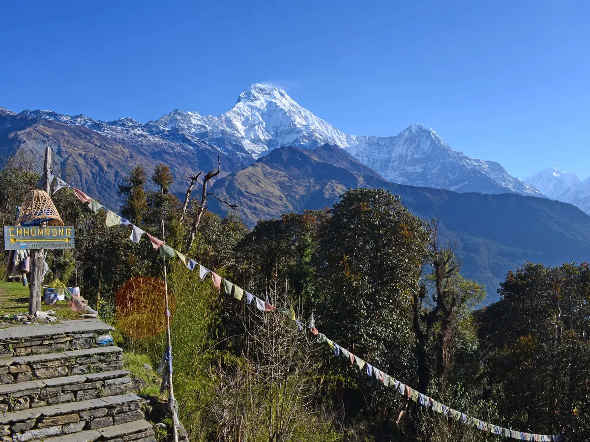 Stone steps and signpost for Chhomrong village along Ghorepani Annapurna Base Camp trek route