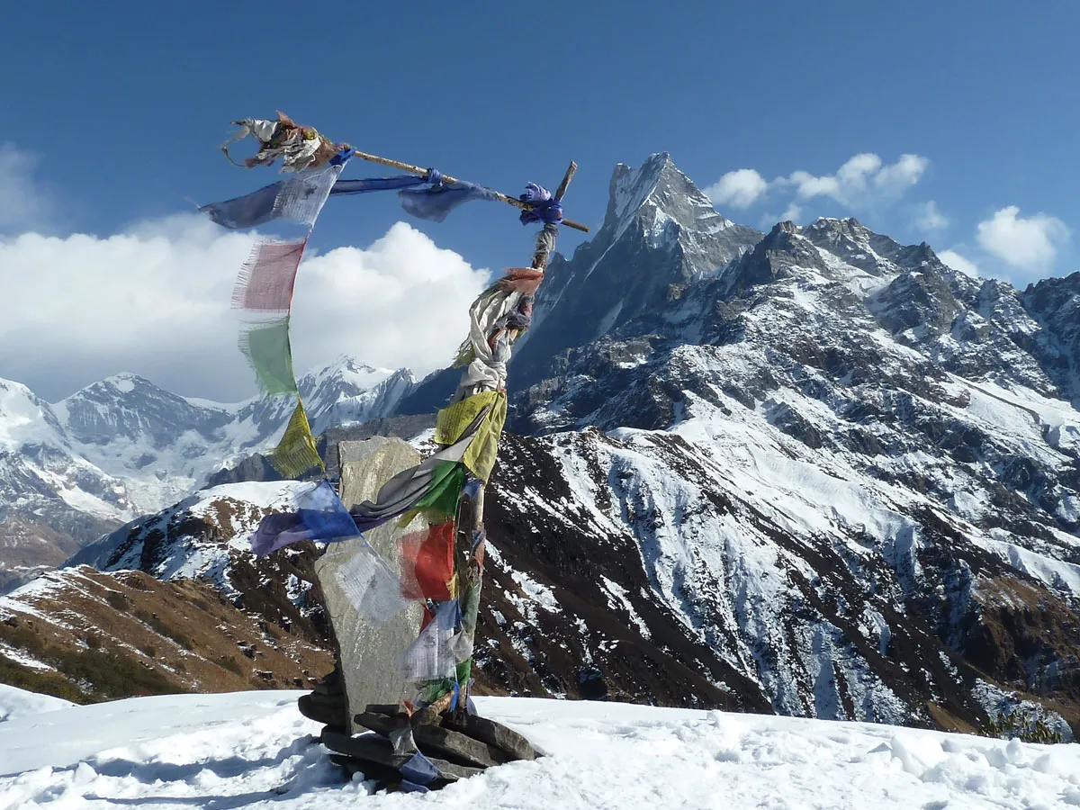 Buddhist prayer flags set against the snow-covered peak of Mount Machhapuchhre (Fishtail).