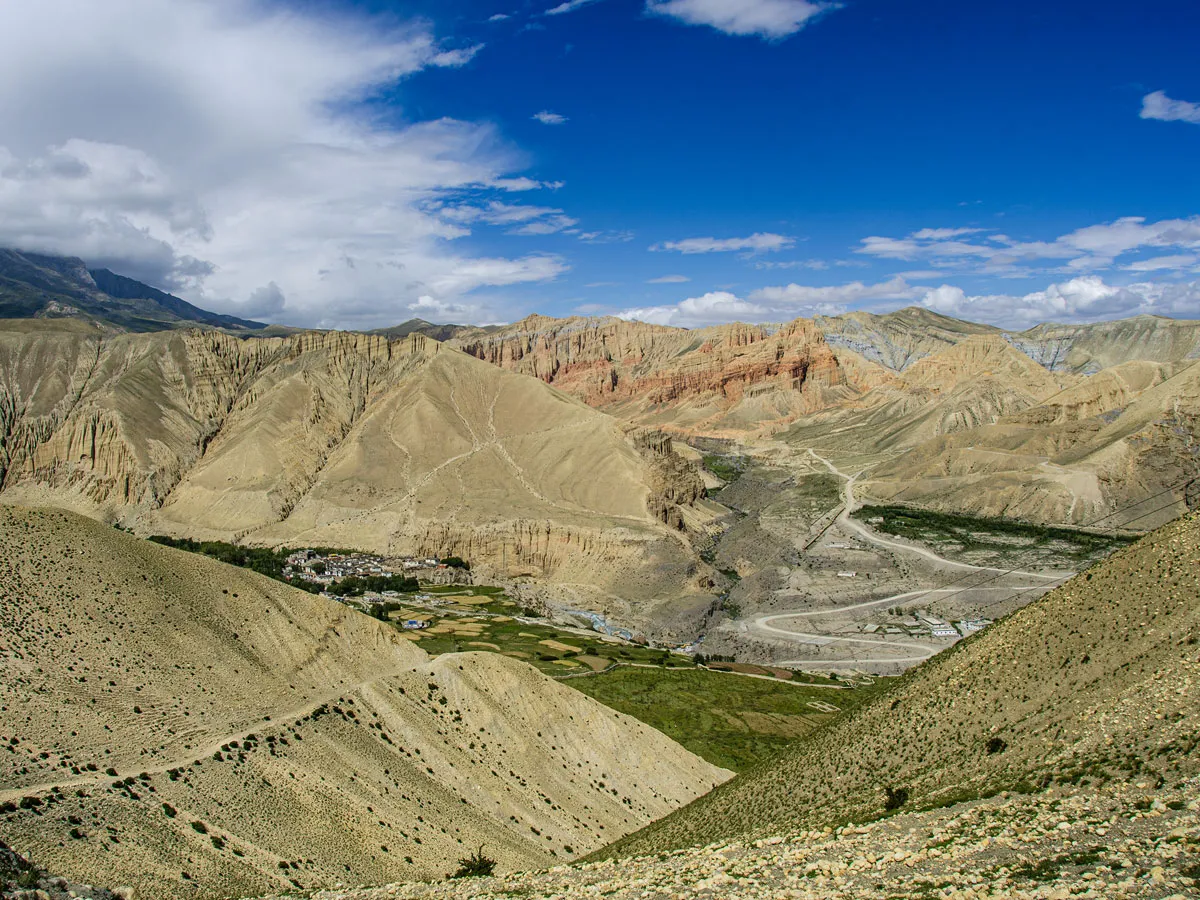 Panoramic view of the arid desert landscape and mountain valley leading to Lo Manthang, Upper Mustang.