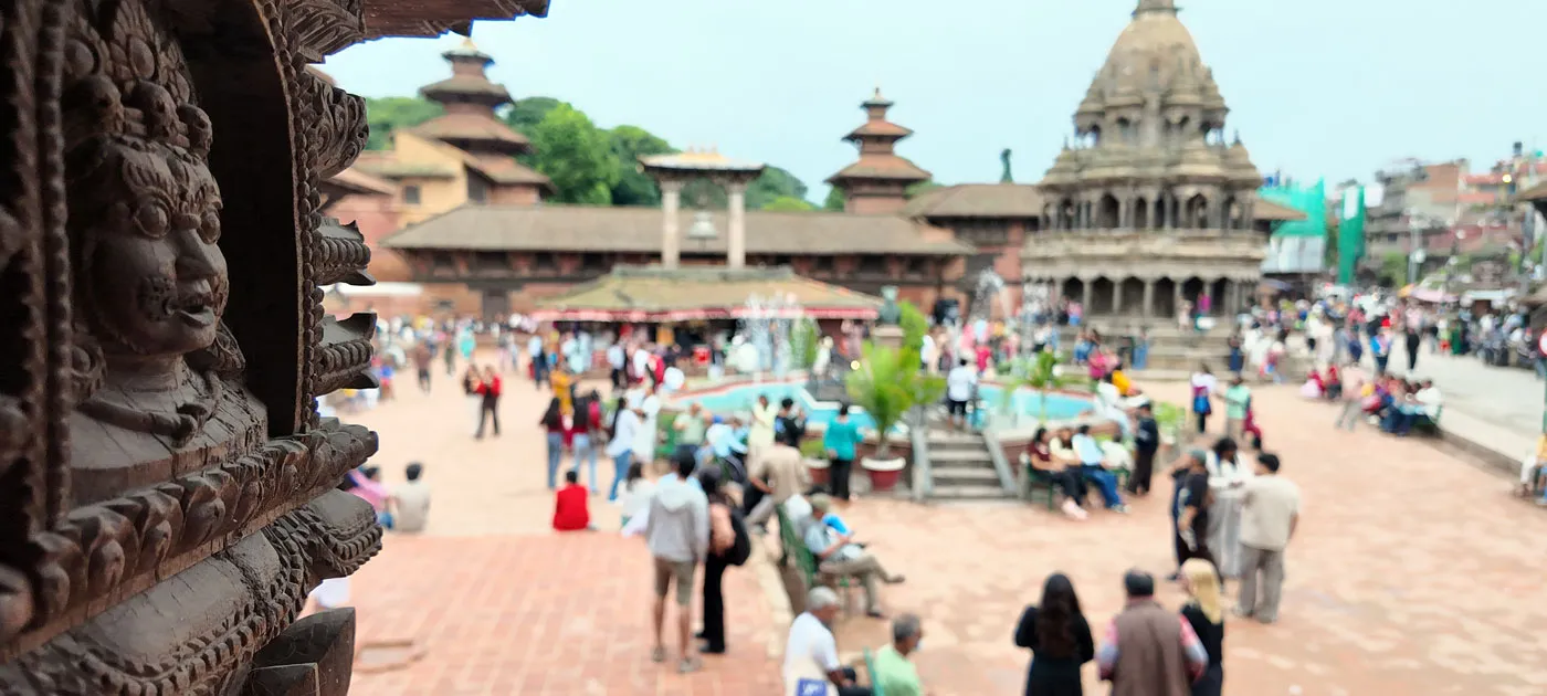 people explore around patan durbar square in nepal safely