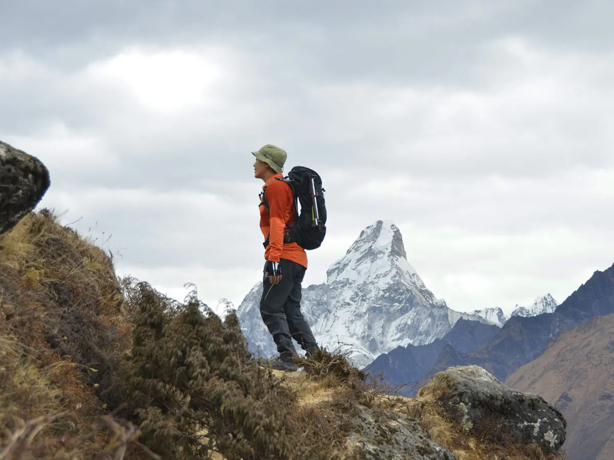 Trekker on trail facing Ama Dablam