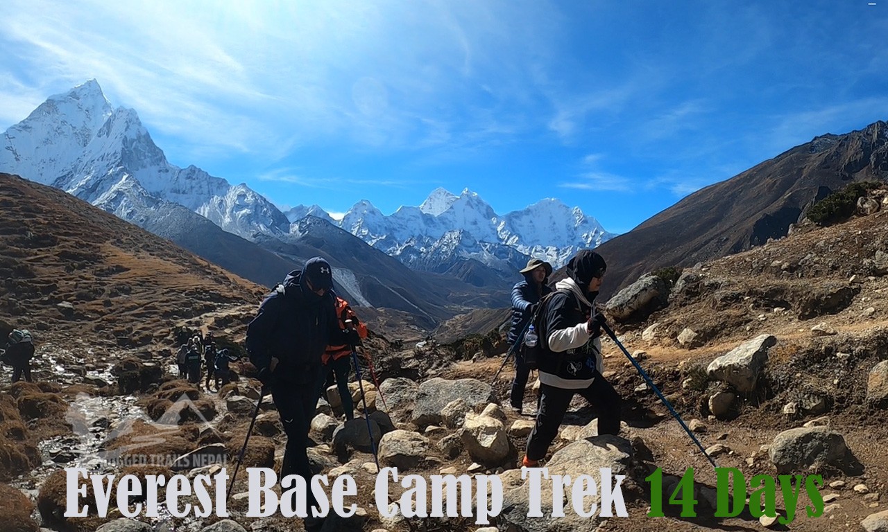trekkers walking towards lobuche and mt amadadlam on back