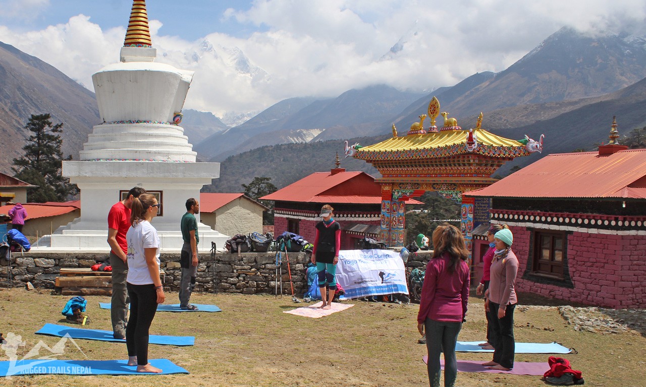 trekkers dong yoga at tengboche monastery