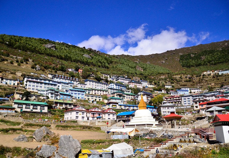 The colorful terraced hillside of Namche Bazaar showing high-altitude teahouses