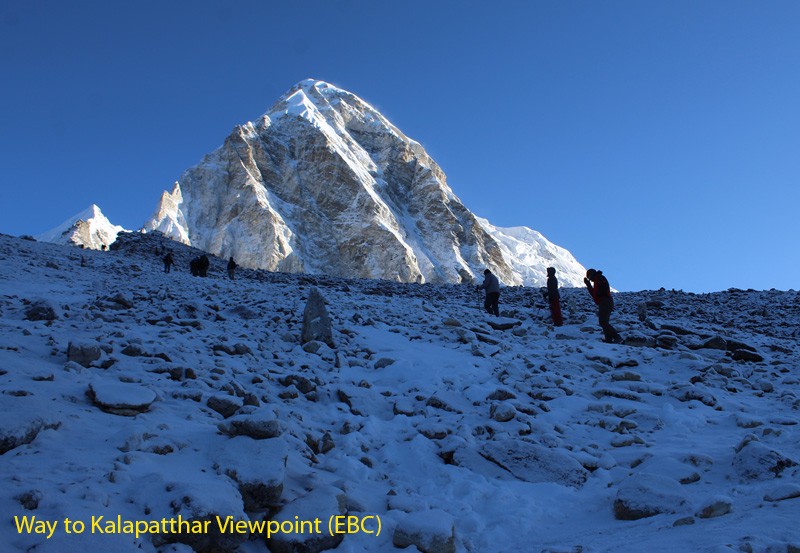 snow-dusted rocky trail toward the peak of Mount Pumori near Kala Patthar viewpoint