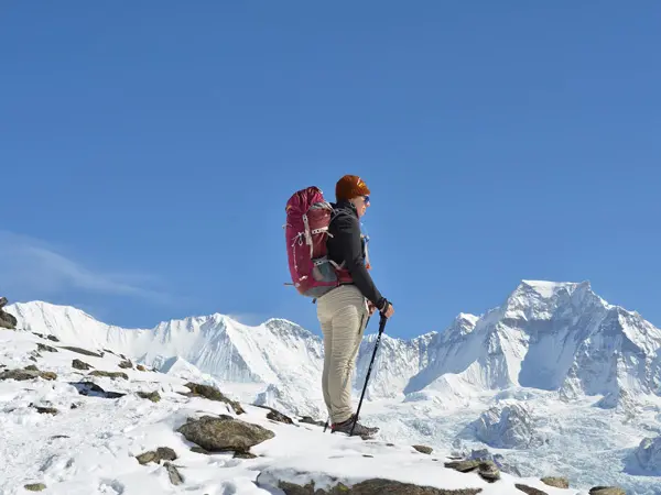 trekker looking toward the mountains from gokyo ri