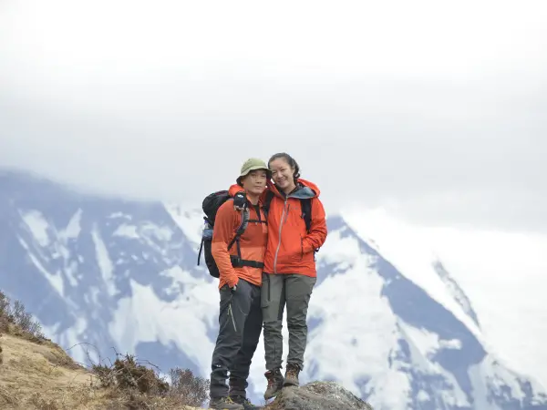 Couple Hikers Snow Mountain Backdrop