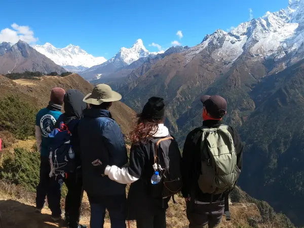 Trekkers Viewing Mount Everest And Ama Dablam