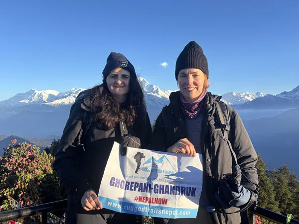 happy trekker at poon hill with rugged trails nepal