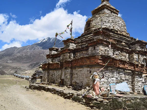 Ancient stone Buddhist chorten along a trekking trail in Nar Phu Valley, Nepal