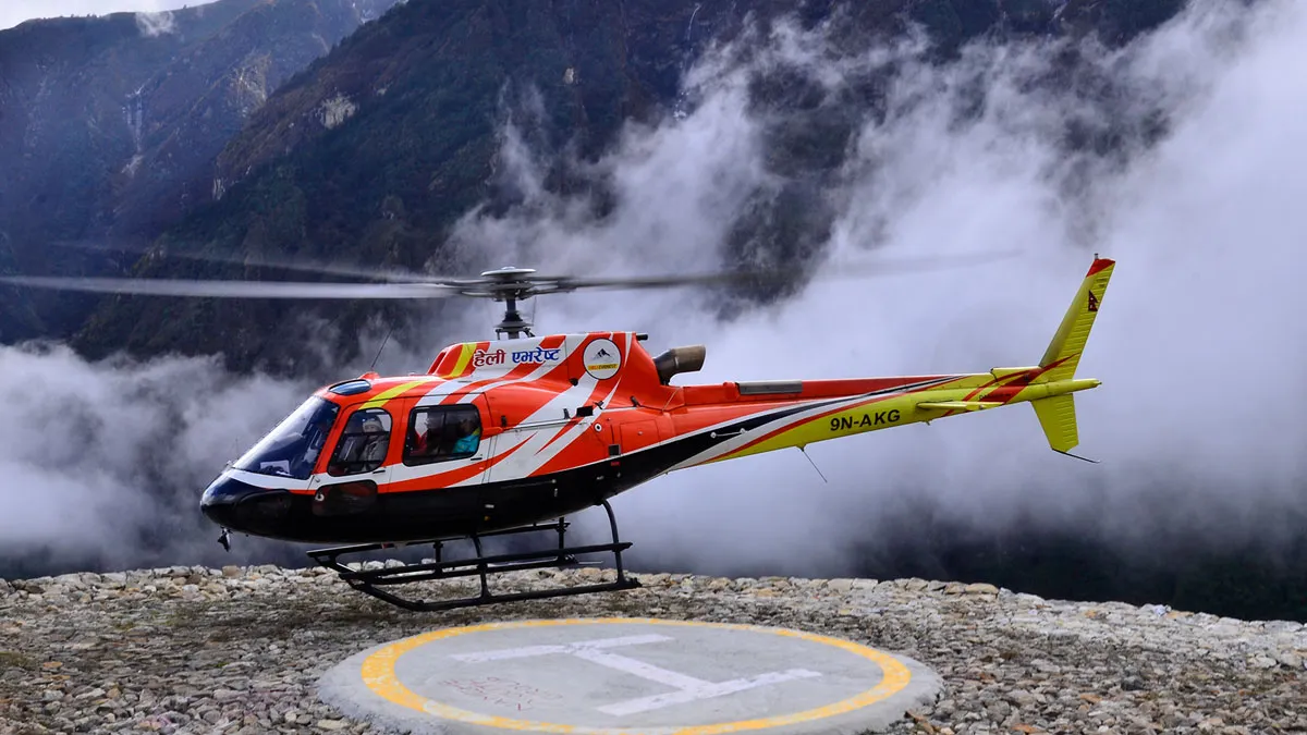 heli everest taking of in everest region above the clouds