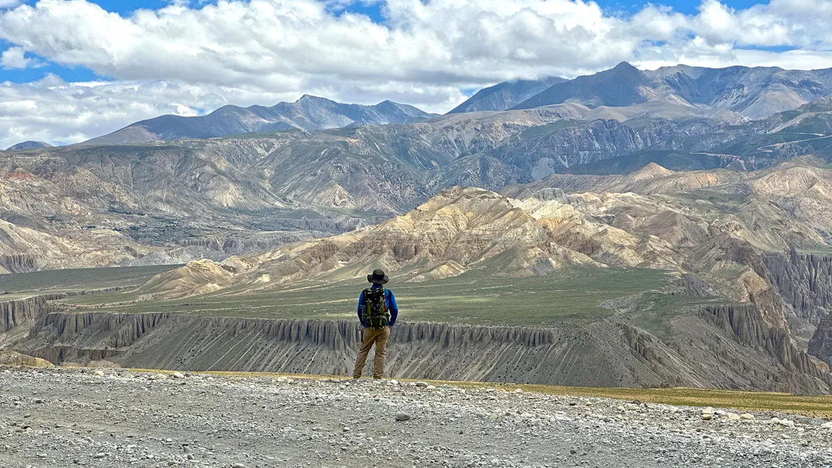 trekker watching upper mustang landscapes